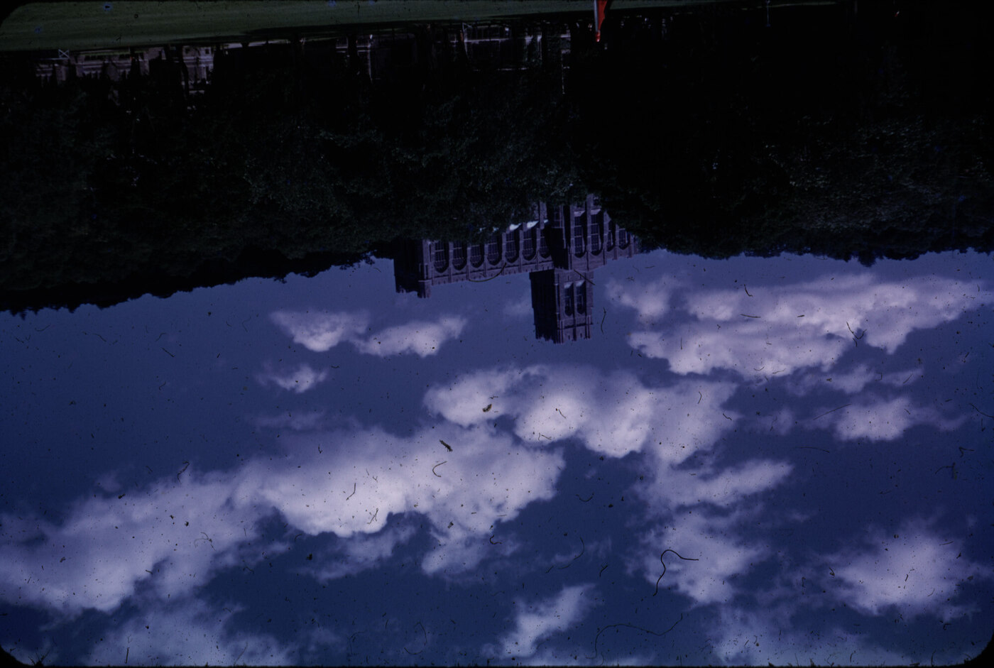 Original slide scan of a chapel, sideways, dark, and covered in dust and debris